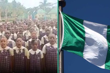 School children singing old Nigerian national anthem.