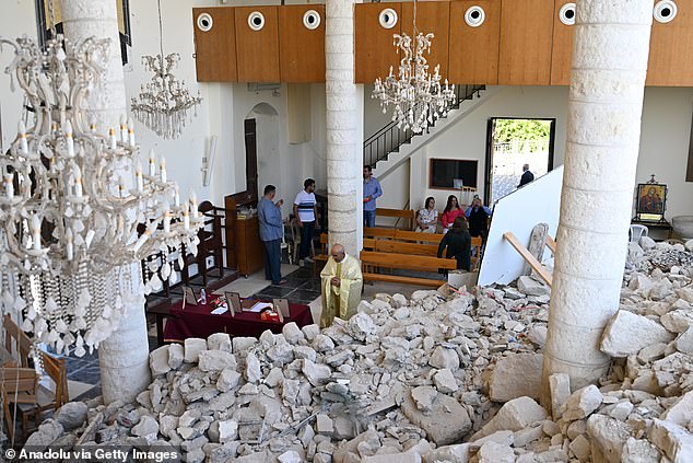 Christians attend the Easter mass at the Saint George Melkite Greek Catholic Church, which was almost completely destroyed by Israeli airstrikes, in the town of Derdghaya, Tyre, Lebanon on April 20, 2025