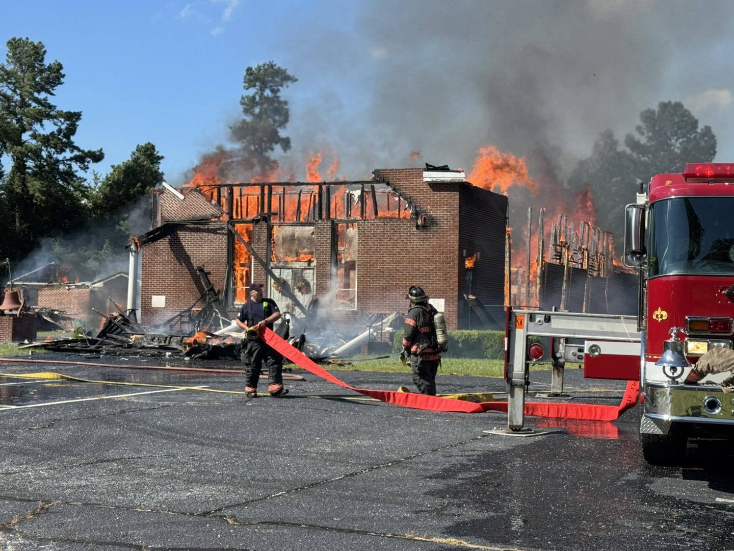 Members praise God in tents after fire destroys historic church