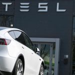 Tesla's profits plunge despite record revenue and deliveries