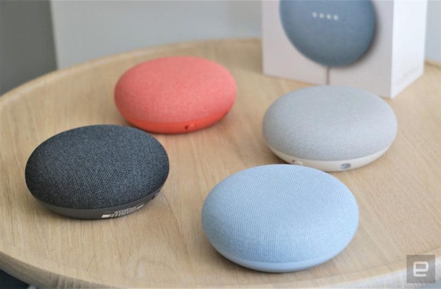 Google Nest Mini devices sitting on a table.