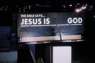 Man paints over heretical billboard to read 'Jesus is God'